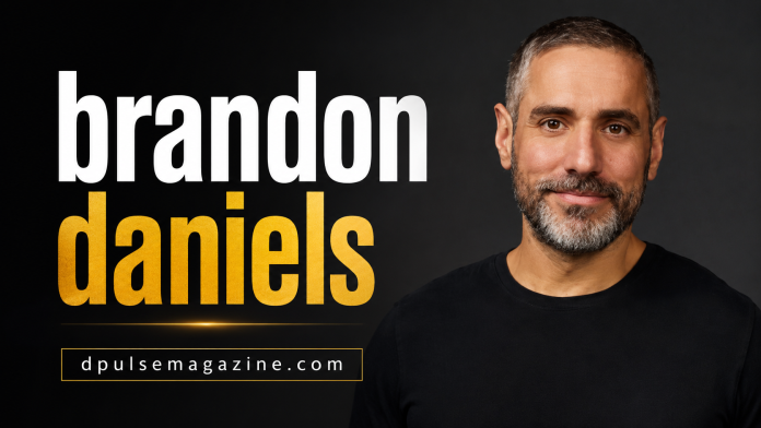 Brandon Daniels smiling during a professional public appearance